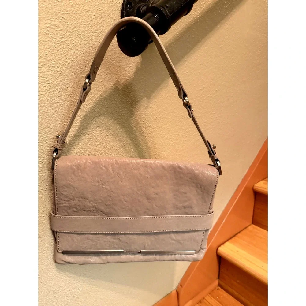 Beautiful Cream leather clutch with detachable shoulder strap by Kenneth Cole